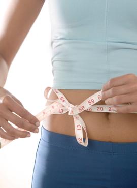 Person measures waist
